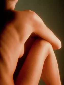 Back view of the torso/legs of a seated woman