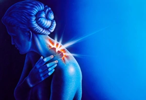 Woman touching her shoulder in pain Woman touching her shoulder in pain