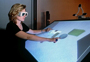 Woman using a 3-D computer-aided design system Woman using a 3-D computer-aided design system