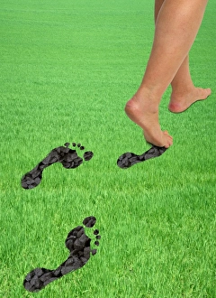 A womans feet leaving carbon footprints A womans feet leaving carbon footprints