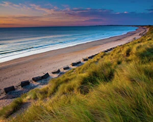 England, Northumberland, Druridge Bay. A dramatic expanse of sand dunes fringing the picturesque beach at Druridge Bay
