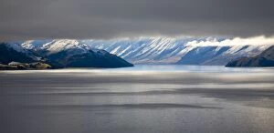 Images Dated 14th July 2007: New Zealand, Otago, Lake Hawea. The Southern Alps revealed through a small gap between dense snow