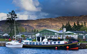 Scotland, Scottish Highlands, Fort Augustus. Tourist sight seeing barge moored on the Caledonian Canal in Scotland, Scottish Highlands, Fort Augustus. Tourist sight seeing barge moored on the Caledonian Canal in