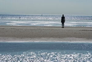Merseyside Gallery: Two of the 100 men of Another Place, also known as the Iron Men, tatues by Antony Gormley
