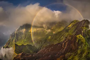 A 180 degree rainbow formed by the clouds over the Kalalau Valley on Kauai' A 180 degree rainbow formed by the clouds over the Kalalau Valley on Kauai'