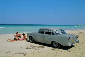 Laying Gallery: 1950s American car on the beach, Goanabo, Cuba, Caribbean Sea, Central America