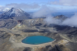 Aerial of a blue lake with Mount Ngauruhoe in the background, Tongariro National Park Aerial of a blue lake with Mount Ngauruhoe in the background, Tongariro National Park
