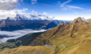 Aerial panoramic of Eiger and sea of clouds surrounding First and Grindelwald in autumn Aerial panoramic of Eiger and sea of clouds surrounding First and Grindelwald in autumn