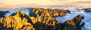 Aerial panoramic of Pico das Torres and Pico do Arieiro mountains in a sea of clouds at Aerial panoramic of Pico das Torres and Pico do Arieiro mountains in a sea of clouds at