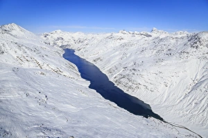 Aerial view of the alpine Lago di Lei surrounded by snow, Val di Lei, Chiavenna, Spluga Valley Aerial view of the alpine Lago di Lei surrounded by snow, Val di Lei, Chiavenna, Spluga Valley