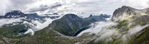 Aerial view of Barden, Breidtinden, Segla mountains and Ornfjord in a sea of clouds Aerial view of Barden, Breidtinden, Segla mountains and Ornfjord in a sea of clouds