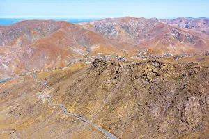 Aerial view of desert road in the barren landscape, Mirador del Risco de las Penas Aerial view of desert road in the barren landscape, Mirador del Risco de las Penas