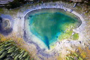 Aerial view by drone of heart shaped Carezza Lake, Dolomites, South Tyrol, Italy, Europe Aerial view by drone of heart shaped Carezza Lake, Dolomites, South Tyrol, Italy, Europe