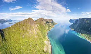 Aerial view of Husfjellet mountain peak overlooking the emerald green water of Steinfjord Aerial view of Husfjellet mountain peak overlooking the emerald green water of Steinfjord