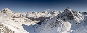 Aerial view of Julier Pass mountain road in the snow leading to St Aerial view of Julier Pass mountain road in the snow leading to St