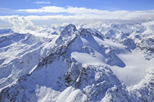 Aerial view of Peak Ferra and Peaks Piani covered with snow, Spluga Valley, Chiavenna Aerial view of Peak Ferra and Peaks Piani covered with snow, Spluga Valley, Chiavenna
