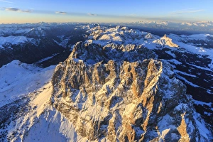 Aerial view of Sassolungo Sassopiatto and Grohmann peaks at sunset, Sella Group, Dolomites Aerial view of Sassolungo Sassopiatto and Grohmann peaks at sunset, Sella Group, Dolomites