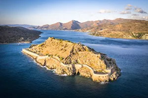 Aerial view of Spinalonga island Venetian fortress and Mirabello bay at dawn Aerial view of Spinalonga island Venetian fortress and Mirabello bay at dawn