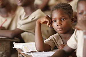 African primary school, young girl in the class room, Lome, Togo, West Africa, Africa African primary school, young girl in the class room, Lome, Togo, West Africa, Africa