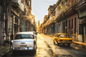American and Russian vintage cars at sunset, La Habana (Havana), Cuba, West Indies American and Russian vintage cars at sunset, La Habana (Havana), Cuba, West Indies