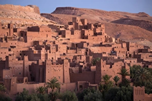 The ancient mud brick buildings of Kasbah Ait Benhaddou bathed in golden morning light The ancient mud brick buildings of Kasbah Ait Benhaddou bathed in golden morning light