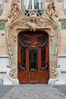 Carved Collection: An art nouveau doorway in central Paris, France, Europe