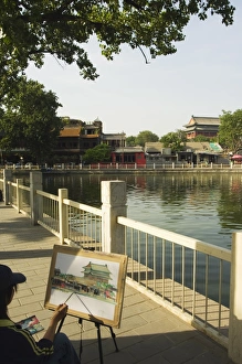An artist painting at Houhai Lake, Beijing, China, Asia An artist painting at Houhai Lake, Beijing, China, Asia