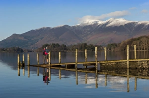 Ashness Boat Landing, two walkers enjoy the Skiddaw Range, Derwentwater, Keswick, Lake District National Park, Cumbria, England, United Kingdom, Europe Ashness Boat Landing, two walkers enjoy the Skiddaw Range, Derwentwater, Keswick, Lake District National Park, Cumbria, England, United Kingdom, Europe