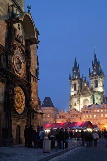 Astronomical Clock of Gothic Old Town Hall, stalls of Christmas Market Astronomical Clock of Gothic Old Town Hall, stalls of Christmas Market
