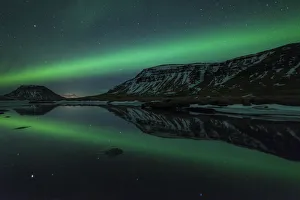 Related Images Gallery: Aurora borealis (Northern Lights) reflected in partially frozen lake, North Snaefellsnes