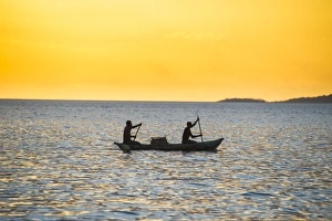 Backlight of fishermen in a little fishing boat at sunset, Lake Malawi, Cape Maclear Backlight of fishermen in a little fishing boat at sunset, Lake Malawi, Cape Maclear