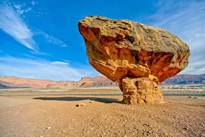Balanced boulder at the base of Vermilion Cliffs in Glen Canyon Recreation Area, Arizona Balanced boulder at the base of Vermilion Cliffs in Glen Canyon Recreation Area, Arizona