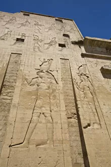Ancient Egyptian Architecture Gallery: Bas Relief of God Horus on the left, First Pylon, Temple of Horus, Edfu, Egypt