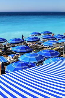 Beach parasols, Nice, Alpes Maritimes, Provence, Cote d'Azur, French Riviera, France, Europe