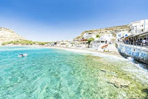 Beach of the seaside town resort of Matala washed by turquoise sea, Crete, Greek Islands Beach of the seaside town resort of Matala washed by turquoise sea, Crete, Greek Islands