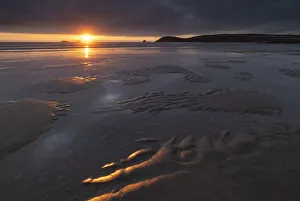 Beautiful sunset light over the beach at Constantine Bay in North Cornwall, England Beautiful sunset light over the beach at Constantine Bay in North Cornwall, England