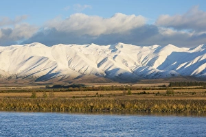 The Ben Ohau Range cloaked in autumn snow, the Pukaki Canal in foreground, Twizel The Ben Ohau Range cloaked in autumn snow, the Pukaki Canal in foreground, Twizel
