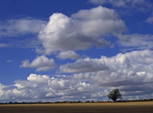 Blue sky with white clouds over farmland near Burford, Oxfordshire, England Blue sky with white clouds over farmland near Burford, Oxfordshire, England