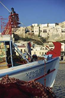 Boat and village, Naxos, Cyclades, Greek Islands, Greece, Europe Boat and village, Naxos, Cyclades, Greek Islands, Greece, Europe