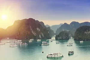 Boats on Halong Bay at sunset, UNESCO World Heritage Site, Vietnam, Indochina, Southeast Asia