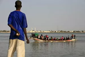 Boy looking at a boat, Saint Louis, Senegal, West Africa, Africa