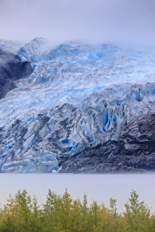 Bright blue ice of Mendenhall Glacier flowing from Juneau Ice Field, mist on Mendenhall Lake