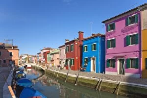 Sun Lit Gallery: Brightly coloured houses along canal in Burano town, Venice Lagoon Island