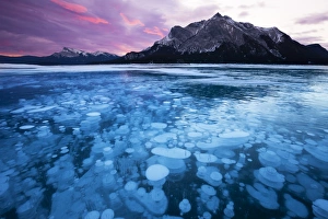 Bubbles and Cracks in the Ice with Mount Michener and Kista Peak in the Background at Sunrise Bubbles and Cracks in the Ice with Mount Michener and Kista Peak in the Background at Sunrise