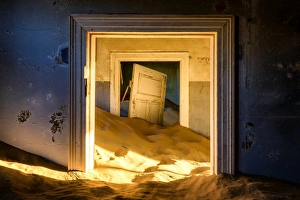 Building taken over by sand, former diamond mining town, now ghost town, Kolmanskop Building taken over by sand, former diamond mining town, now ghost town, Kolmanskop