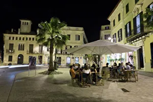 Cafe scene at night in the old town, Placa del Princep, Mahon, Menorca, Balearic Islands Cafe scene at night in the old town, Placa del Princep, Mahon, Menorca, Balearic Islands
