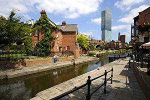 Canal and lock keepers cottage at Castlefield with the Beetham Tower in the background