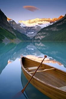 Serene Gallery: Canoe on Lake Louise at Sunrise, Lake Louise, Banff National Park, Alberta, Canada