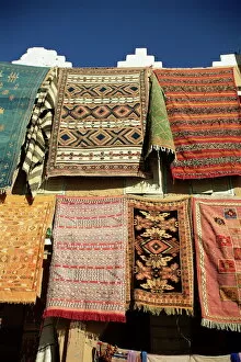 Images Dated 4th January 2000: Carpets for sale outside shop in frontier town of Agdz