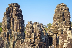Carved stone faces at Prasat Bayon temple ruins, Angkor Thom, UNESCO World Heritage Site Carved stone faces at Prasat Bayon temple ruins, Angkor Thom, UNESCO World Heritage Site